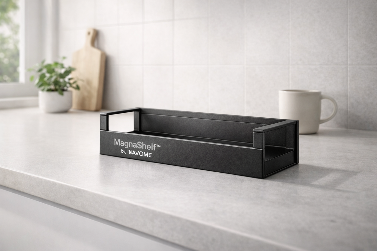 Black magnetic shelf on a kitchen counter with 'MagnaShelf' branding.